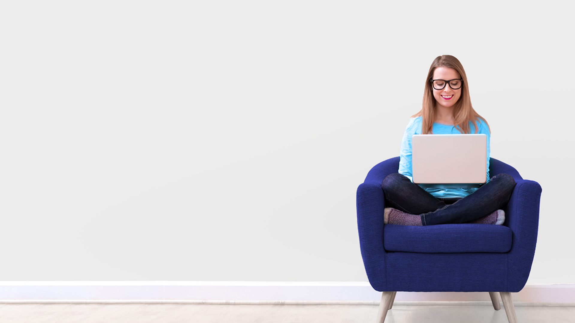 Person sitting on chair using laptop